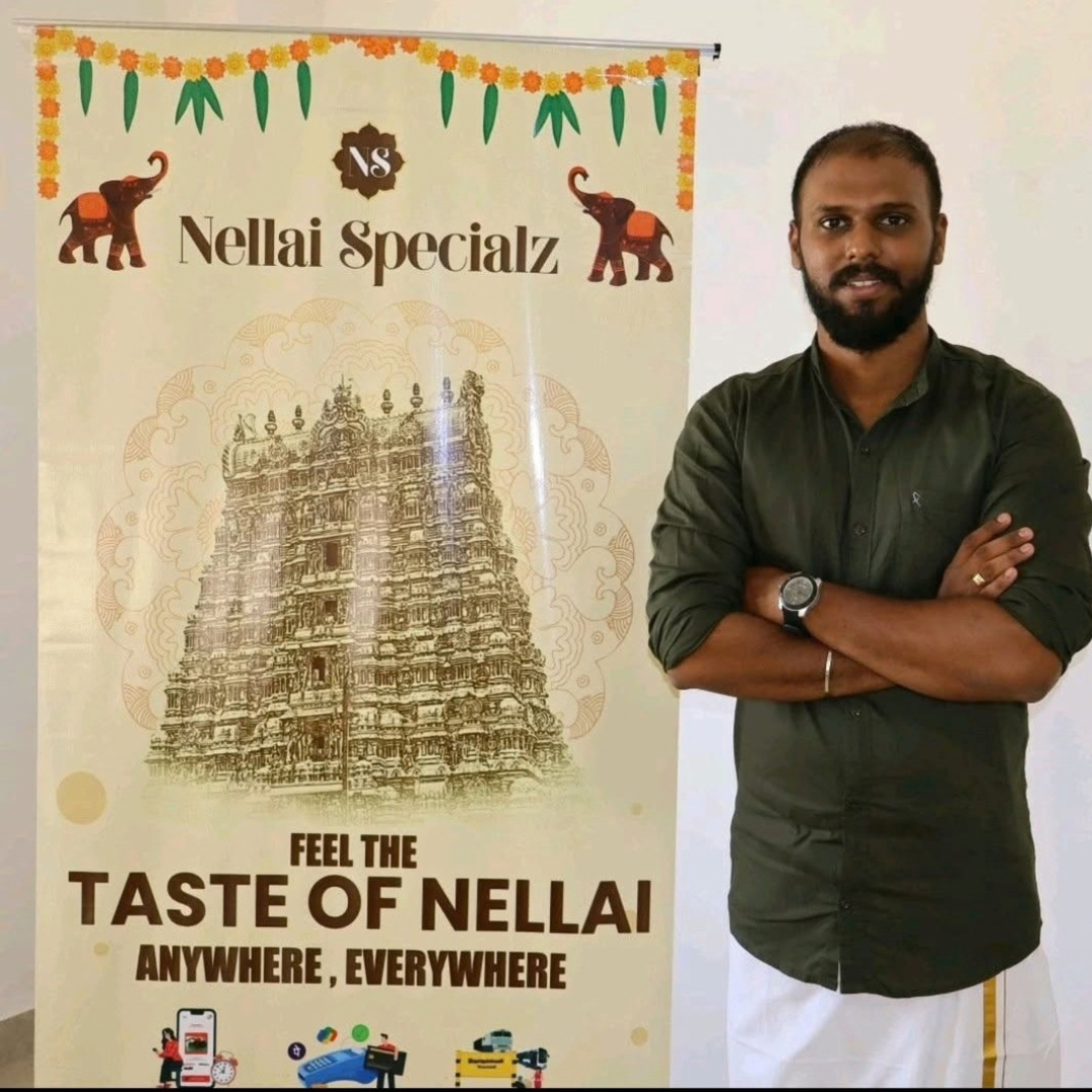 Nellai Specialz founder beside a branded heritage display